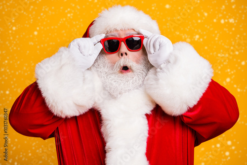 Close-up portrait of his he nice attractive amazed Santa father newyear pout lips touching specs cool bargain offer shopping isolated over bright vivid shine vibrant yellow color background