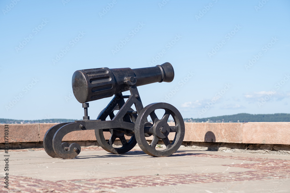 A historic cannon from the Alexander factory stands on the embankment of Lake Onega in Petrozavodsk, highlighting the scenic view A historic cannon from the Alexander factory stands on the embankment of Lake Onega in Petrozavodsk, highlighting the scenic view