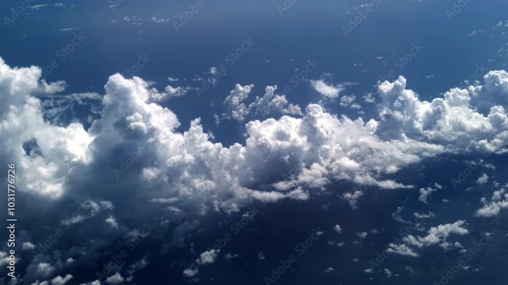 A bird's eye view of the clouds reveals a breathtaking landscape. Fluffy white clouds and a picturesque moment in nature, showing the beauty of the sky. A bird's eye view of the clouds reveals a breathtaking landscape. Fluffy white clouds and a picturesque moment in nature, showing the beauty of the sky.