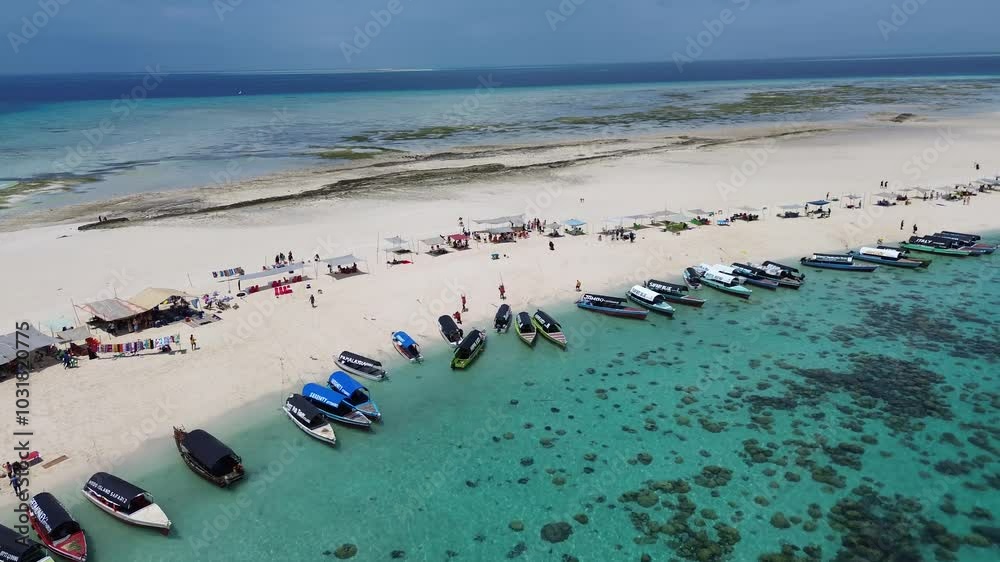 Nakupenda Island Tanzania view of the boat and the gazebo set up to prepare lunch before the sandbank disappear under the ocean Nakupenda Island Tanzania view of the boat and the gazebo set up to prepare lunch before the sandbank disappear under the ocean