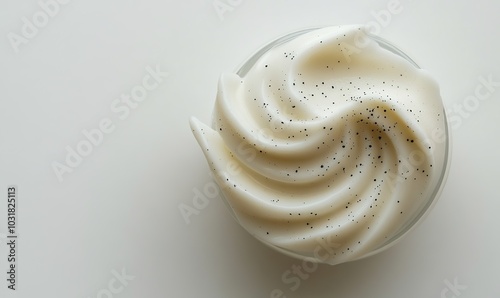  Abstract Representation of an Eco-Friendly Body Scrub Product Featuring a Creamy Smooth Texture with Fine Black Specks, Centered on the Right Side Against a White Background, Highlighting Its Natural