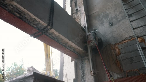 Cutting Concrete Wall Panel with Wall Saw. Construction and Demolition Work