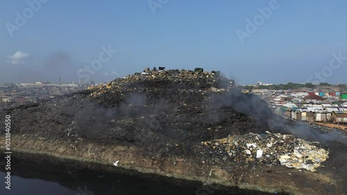 Ghana, Accra,   AGBOGBLOSHIE drone view Odaw River the largest landfill illegal dump in Africa for electronic and plastic waste from the Western world. mountain of toxic waste, environmental disaster 