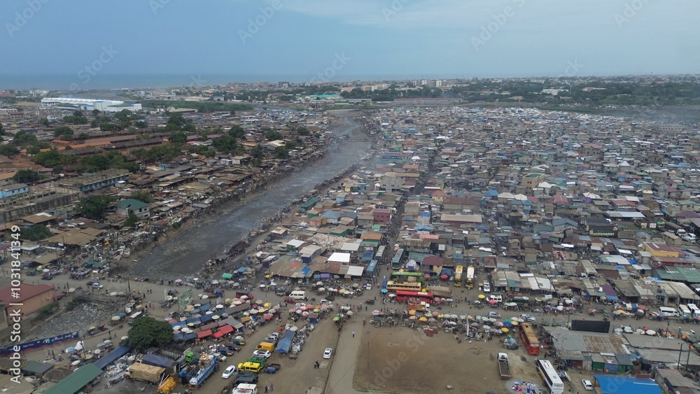 Ghana, Accra, AGBOGBLOSHIE drone view Odaw River the largest landfill illegal dump in Africa for electronic and plastic waste from the Western world. mountain of toxic waste, environmental disaster