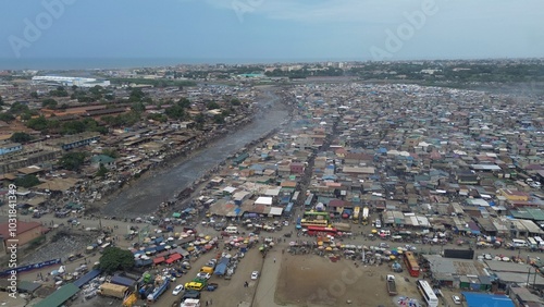 Obraz na płótnie Ghana, Accra, AGBOGBLOSHIE drone view Odaw River the largest landfill illegal dump in Africa for electronic and plastic waste from the Western world. mountain of toxic waste, environmental disaster w salonie