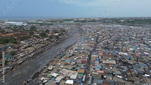People live in slums immersed  immersed in toxic waste that poisons the land and river waters in Africa Africa Ghana  AGBOGBLOSHIE. high environmental pollution area , Climate change global warming 