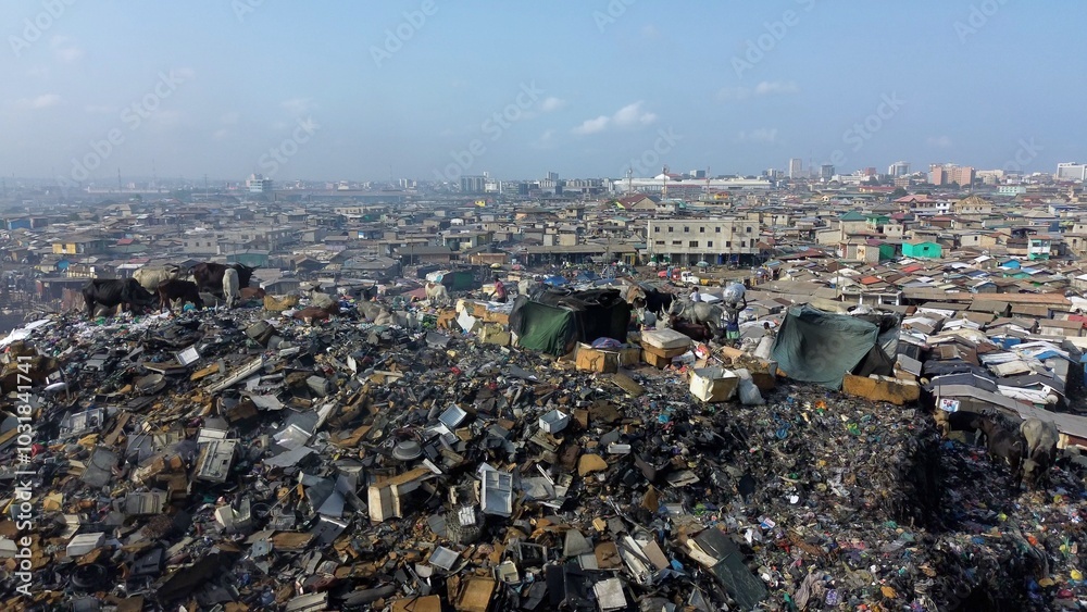 Ghana, Accra, AGBOGBLOSHIE drone view Odaw River the largest landfill illegal dump in Africa for electronic and plastic waste from the Western world. mountain of toxic waste, environmental disaster
