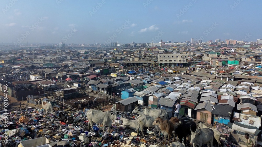 Ghana, Accra, AGBOGBLOSHIE drone view Odaw River the largest landfill illegal dump in Africa for electronic and plastic waste from the Western world. mountain of toxic waste, environmental disaster