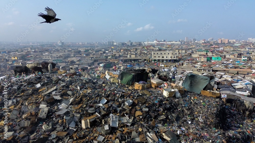 Ghana, Accra, AGBOGBLOSHIE drone view Odaw River the largest landfill illegal dump in Africa for electronic and plastic waste from the Western world. mountain of toxic waste, environmental disaster
