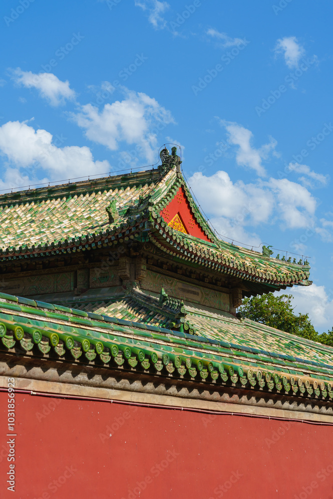 Decoration details of gates and palaces in the Temple of Heaven under blue sky,  a major landmark and travel destination in Beijing, China