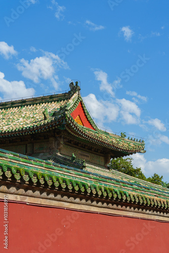 Decoration details of gates and palaces in the Temple of Heaven under blue sky, a major landmark and travel destination in Beijing, China