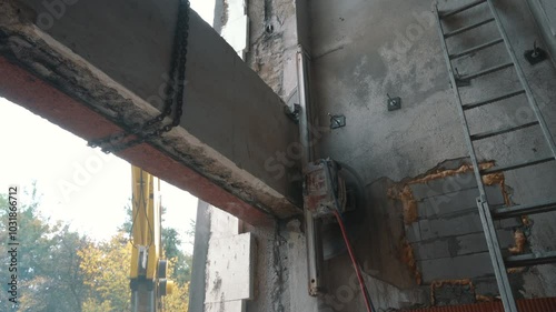 Cutting Concrete Wall Panel with Wall Saw. Construction and Demolition Work