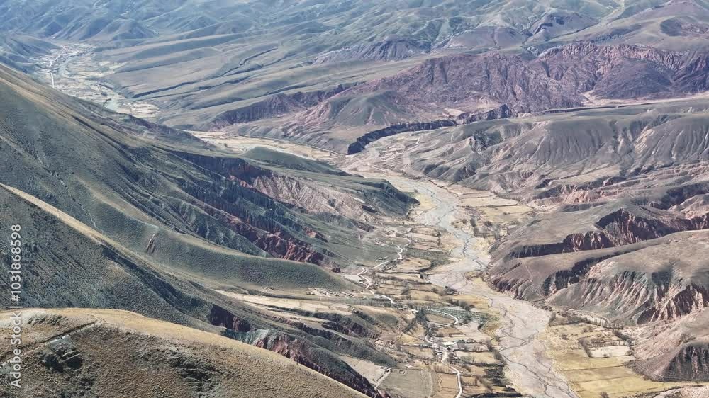 Bird's-eye view of a colorful and arid valley in the province of Jujuy, Argentina. Bird's-eye view of a colorful and arid valley in the province of Jujuy, Argentina.
