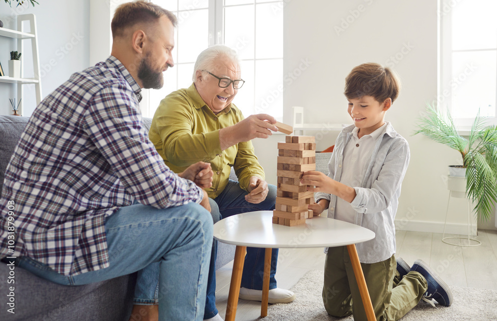 Father, son, and grandfather enjoy leisure time playing a game together at home. They laughing and bonding as a family, celebrating Father Day with joy and fun in a relaxed atmosphere. Father, son, and grandfather enjoy leisure time playing a game together at home. They laughing and bonding as a family, celebrating Father Day with joy and fun in a relaxed atmosphere.