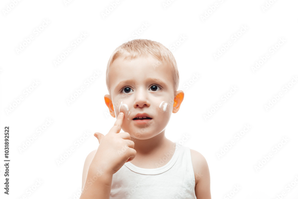 applying moisturizing cream on baby face on white background. Care about children clean and soft body skin applying moisturizing cream on baby face on white background. Care about children clean and soft body skin