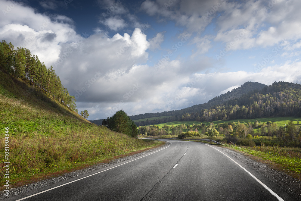 Fototapeta premium country road in a mountain landscape