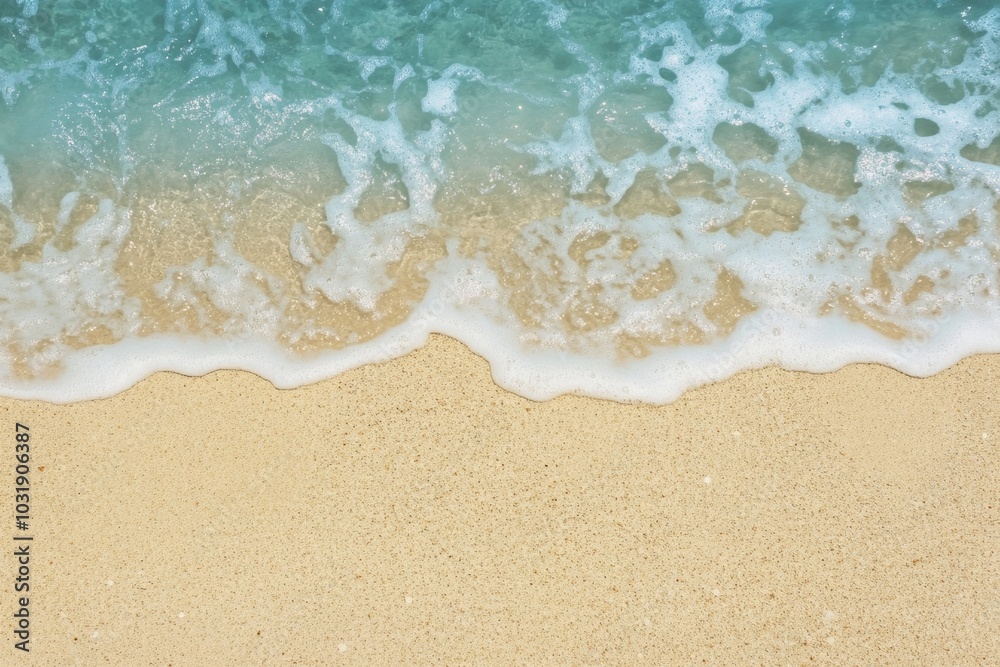 Top-down view of a sandy beach with blue water and waves, web banner design with copy space on the right for text or graphics. Top-down view of a sandy beach with blue water and waves, web banner design with copy space on the right for text or graphics.