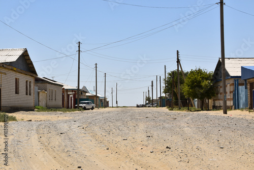 A dirt road through the town of Aral in Kazakhstan