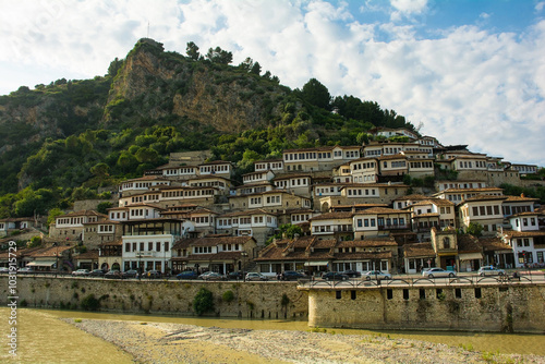 Traditional Ottoman houses in the historic Mangalem quarter of Berat, Albania. Berat is UNESCO World Heritage Site listed, known as City of a Thousand Windows. Castle on Kalaja Hill in the background