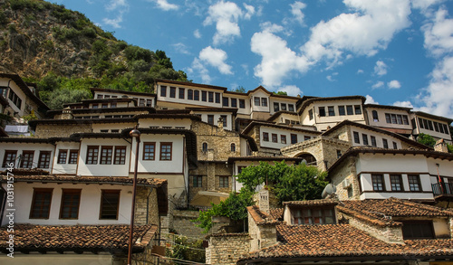 Traditional Ottoman houses in the historic Mangalem quarter of Berat in Albania. Berat is UNESCO World Heritage Site listed and is known as City of a Thousand Windows. Kalaja Hill in the background