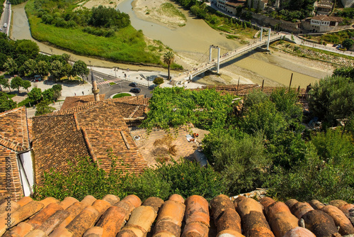 View of traditional Ottoman houses in the historic Mangalem quarter of Berat, Albania. UNESCO World Heritage Site listed, known as City of a Thousand Windows. River Osum and White or Hanging Bridge