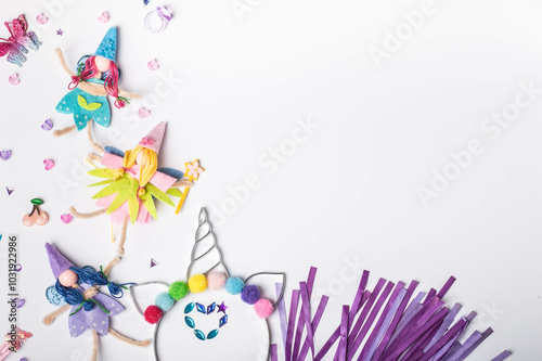 Fairy dolls for magical creativity. Whimsical fairies and sparkling accessories. Craft supplies featuring fairies with space for notes. Flat lay. Top view.