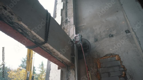 Cutting Concrete Wall Panel with Wall Saw. Construction and Demolition Work