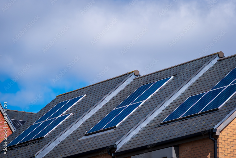 Fototapeta premium Solar energy panel on new built house roof in england uk