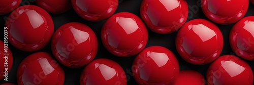 Close up view of shiny red balls arranged neatly on a flat surface during day...