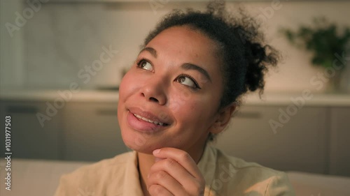 Close up African American woman smiling dreaming ethnic girl positive happy inspired female lady thinking dreaming at home pondering idea planning future dream ponder wish think imagine daydream smile