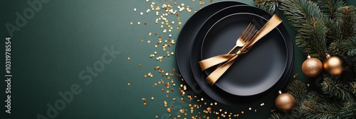 A beautifully arranged holiday table features a black plate tied with a gold ...