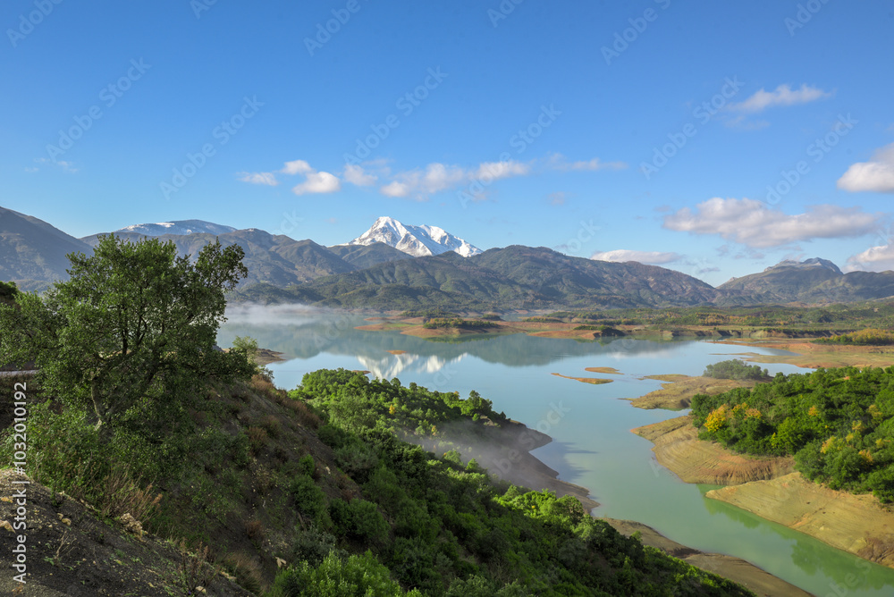 Beautiful landscape of lake and reflection of blue sky, clouds and mountains on surface of lake, Panoramic view of lake and snow-covered mountain and Forest trees calm in Jijel Algeria North African. Beautiful landscape of lake and reflection of blue sky, clouds and mountains on surface of lake, Panoramic view of lake and snow-covered mountain and Forest trees calm in Jijel Algeria North African.