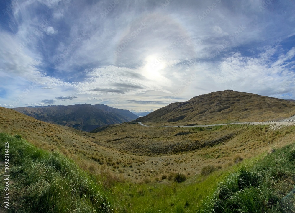 Scenic views at the Crown Range Summit Lookout . Landscape with mountains and clouds Scenic views at the Crown Range Summit Lookout . Landscape with mountains and clouds