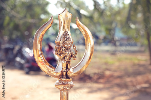 Kalabairava gold metal statue in trident photo