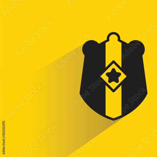 shield badge with shadow on yellow background