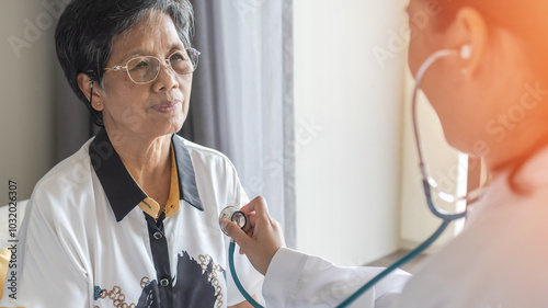 Elderly patient heart health check by medical geriatric doctor for awareness in stroke systolic high blood pressure, hypertension, hypotension and cardiovascular disease in aged senior older woman