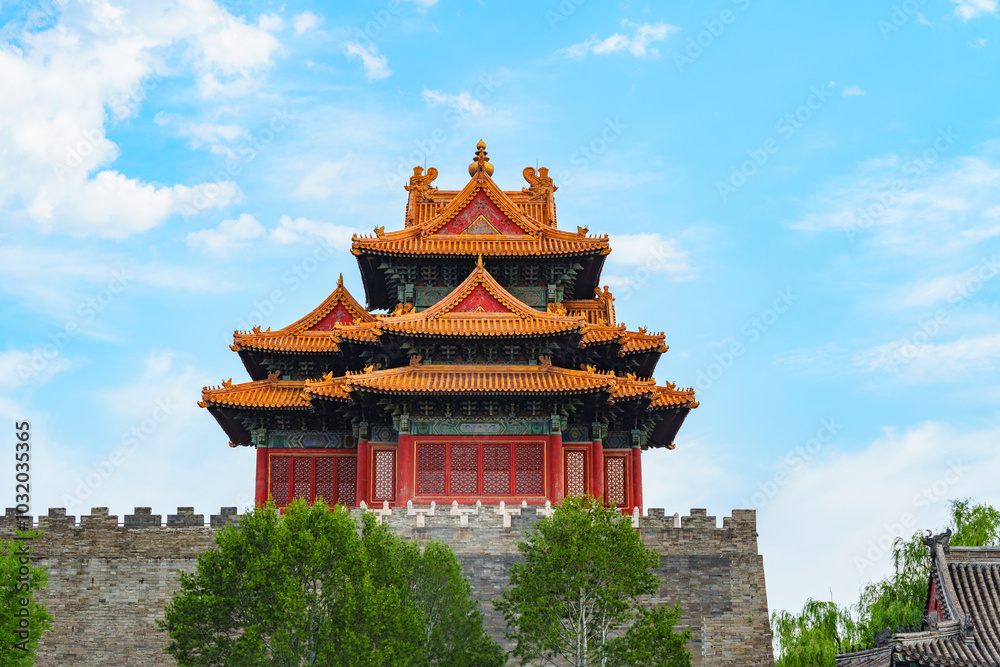 Watch Tower of Forbidden City under blue sky with white cloud at sunset in Beijing, China Watch Tower of Forbidden City under blue sky with white cloud at sunset in Beijing, China