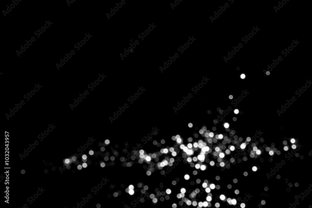 White gray blurred bokeh lights on black background White gray blurred bokeh lights on black background