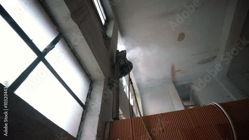 Cutting Concrete Wall Panel with Wall Saw. Construction and Demolition Work