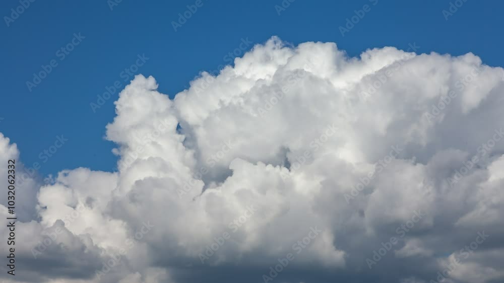 Dynamic fluffy white clouds Formations in the Windy Sky - Nature's Powerful Display of Atmospheric Movement and Beauty. Stop motion shooting. Timelapse. Dynamic fluffy white clouds Formations in the Windy Sky - Nature's Powerful Display of Atmospheric Movement and Beauty. Stop motion shooting. Timelapse.