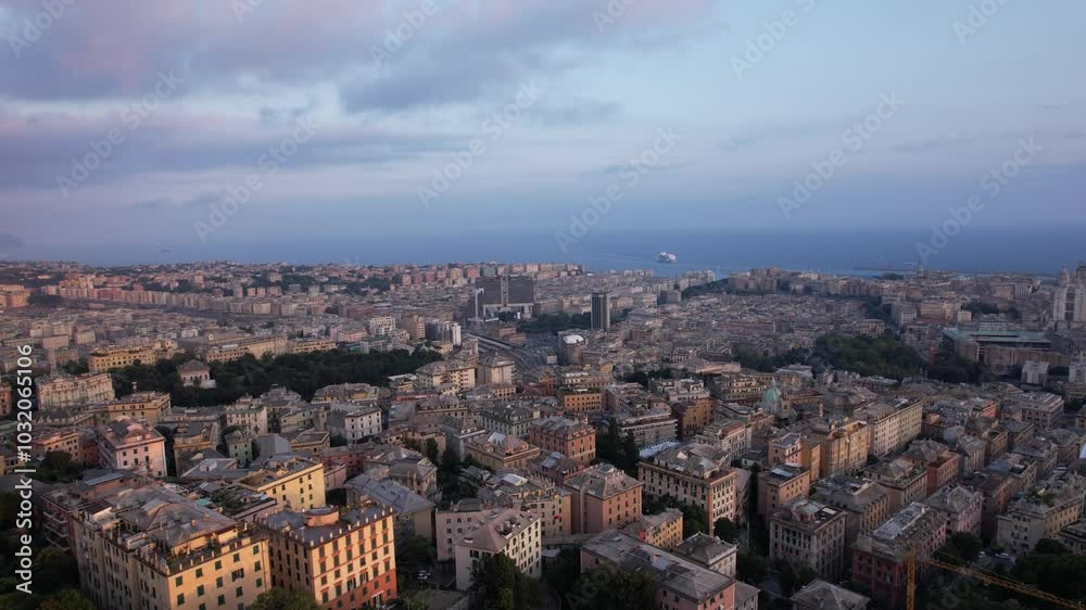 Discover the timeless beauty of Genoa's skyline at dusk as the city lights begin to twinkle Discover the timeless beauty of Genoa's skyline at dusk as the city lights begin to twinkle