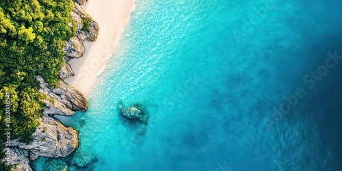 Aerial view of a serene beach with clear turquoise water, rocky coastline, and lush green vegetation, perfect for vacation promotion.