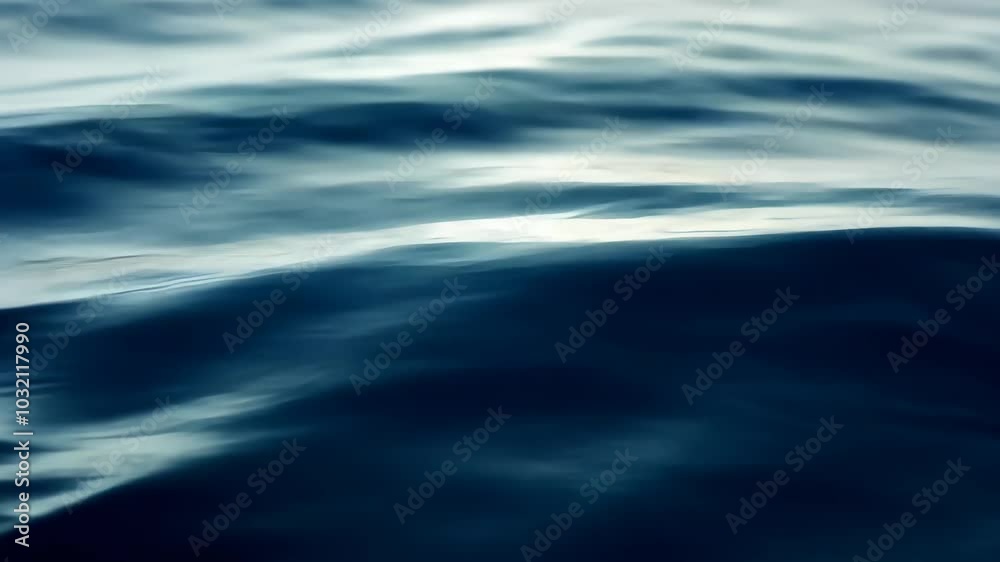 Calm ocean waves in soft light, abstract nature background. Serenity and tranquility concept.