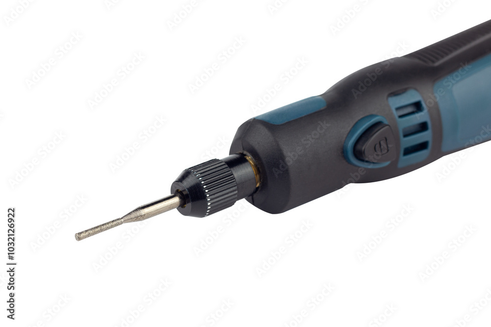 hand engraver with cutter for hand engraver and drill with diamond filings, mini hand drill on battery isolated from background hand engraver with cutter for hand engraver and drill with diamond filings, mini hand drill on battery isolated from background
