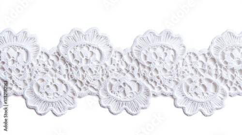 delicate vintage white lace trim with floral pattern, isolated on a white background in a flat lay design, featuring soft cotton lace details, perfect for fashion or crafting projects photo