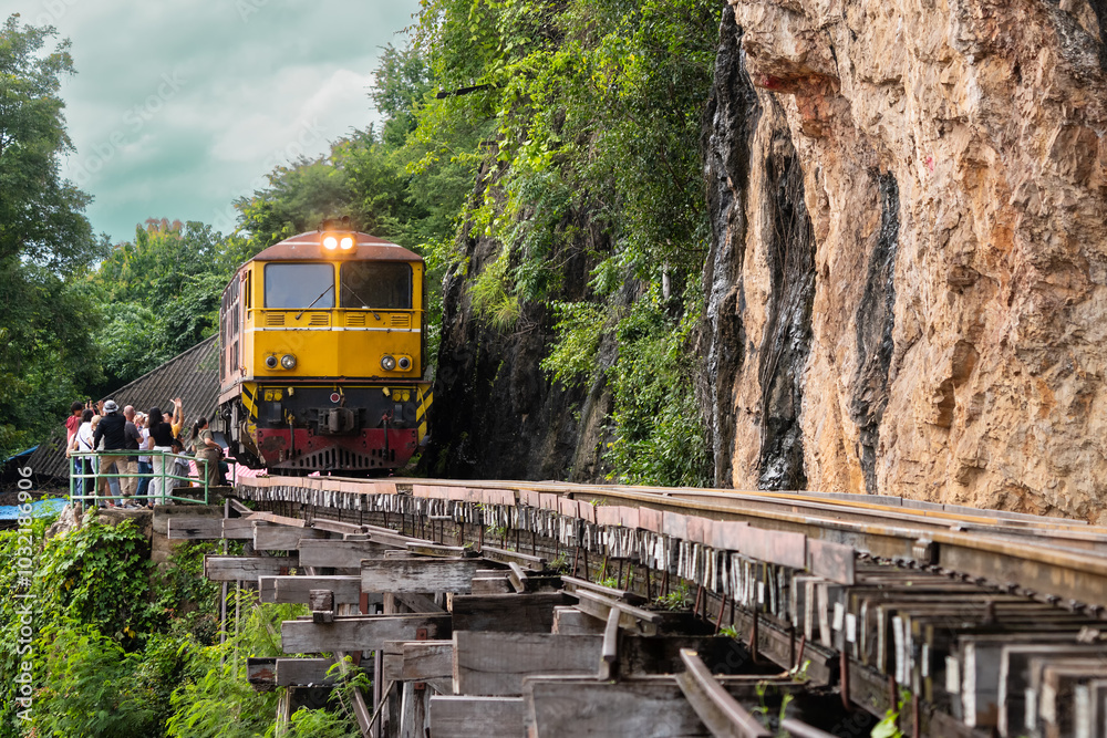 Naklejka premium Trains running on death railways track crossing kwai river in kanchanaburi thailand this railways important destination of world war II history builted by soldier prisoners..