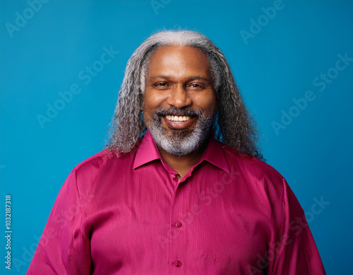 Headshot Portrait of a Smiling Mature Man with Contemporary Style, Isolated on Color Background with Ample Copy Space