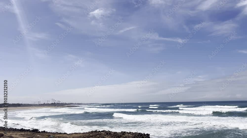 Picturesque view of the ocean beneath a dramatic sky filled with fluffy clouds. The endless horizon meets the calming sea, providing a sense of vastness and serenity. Ideal for backgrounds, relaxation Picturesque view of the ocean beneath a dramatic sky filled with fluffy clouds. The endless horizon meets the calming sea, providing a sense of vastness and serenity. Ideal for backgrounds, relaxation