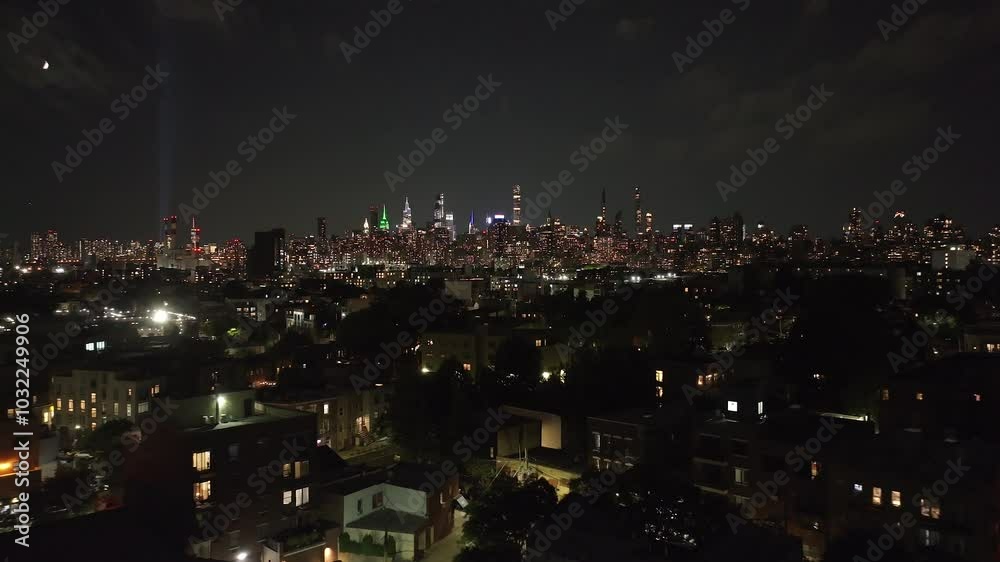 The New York City skyline with lights in remembrance of the lives lost in the 9/11 attack of the twin towers The New York City skyline with lights in remembrance of the lives lost in the 9/11 attack of the twin towers