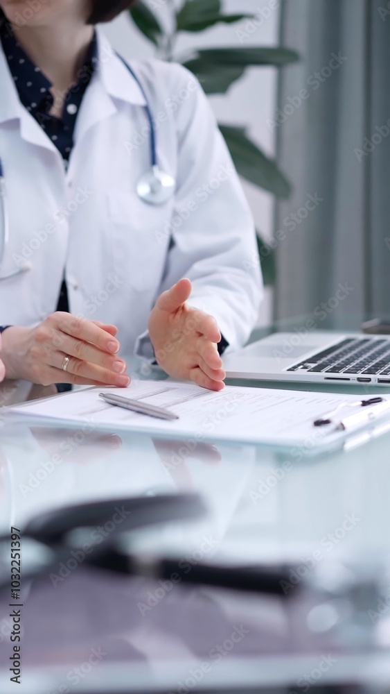 Doctor and patient are sitting and talking at the glass table, Medicine and health care concept Doctor and patient are sitting and talking at the glass table, Medicine and health care concept